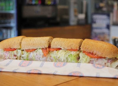jersey mike's sandwich with cold cuts, lettuce, and tomato