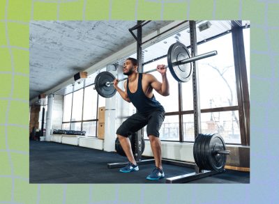 fit, muscular man doing barbell back squats