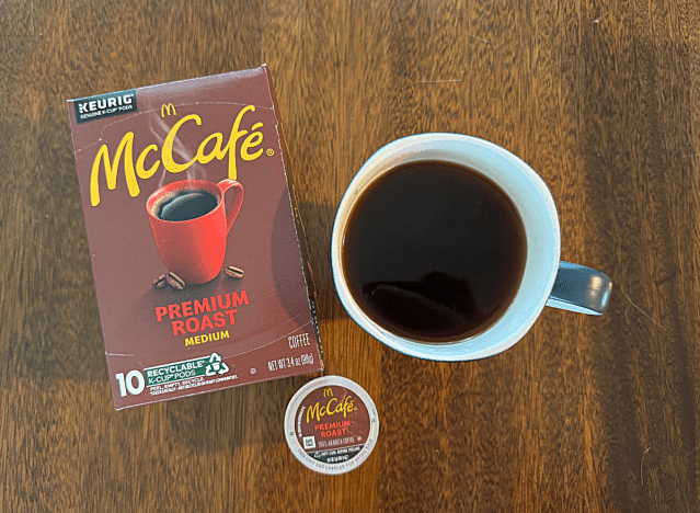 mccafe k cup box next to a mug of coffee 