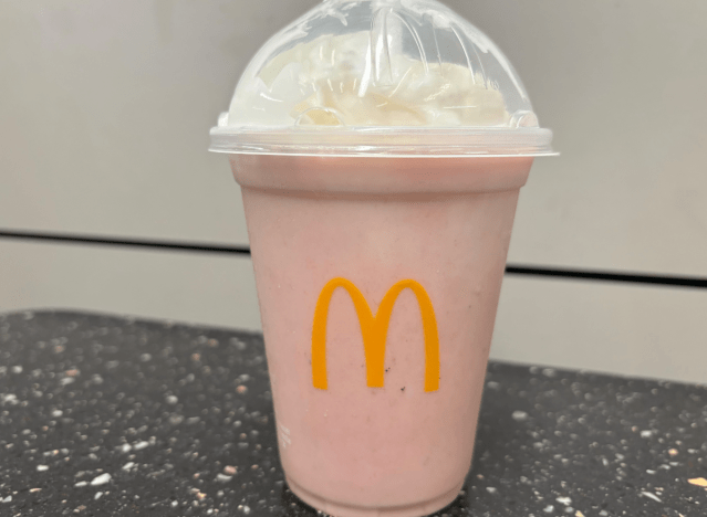 mcdonalds strawberry shake on a table