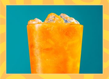 orange soda on blue background with orange border