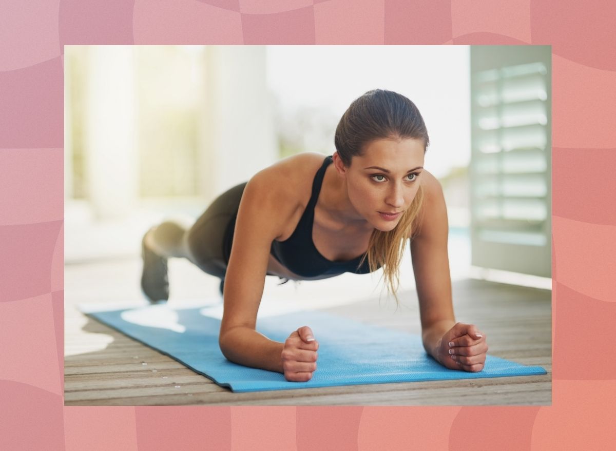 a photo of a woman doing a pilates plank on a designed pink background