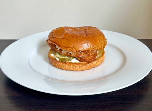 poeyes blackened chicken sandwich on a white plate