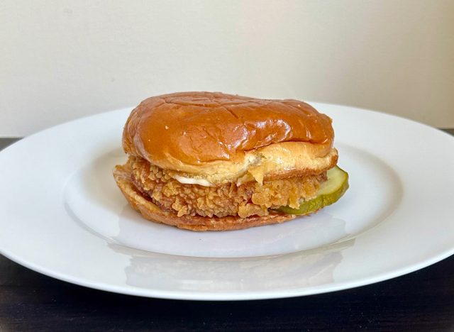 popeyes classic chicken sandwich on a white plate