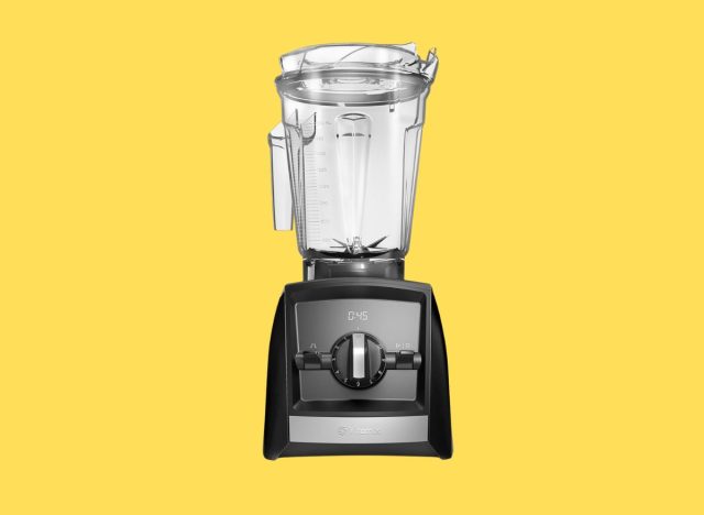 a photo of a Vitamix a2300 blender on a yellow background