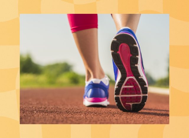 close-up of woman's feet walking on a local track