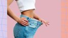 woman dropping pants and jeans size concept on pink background