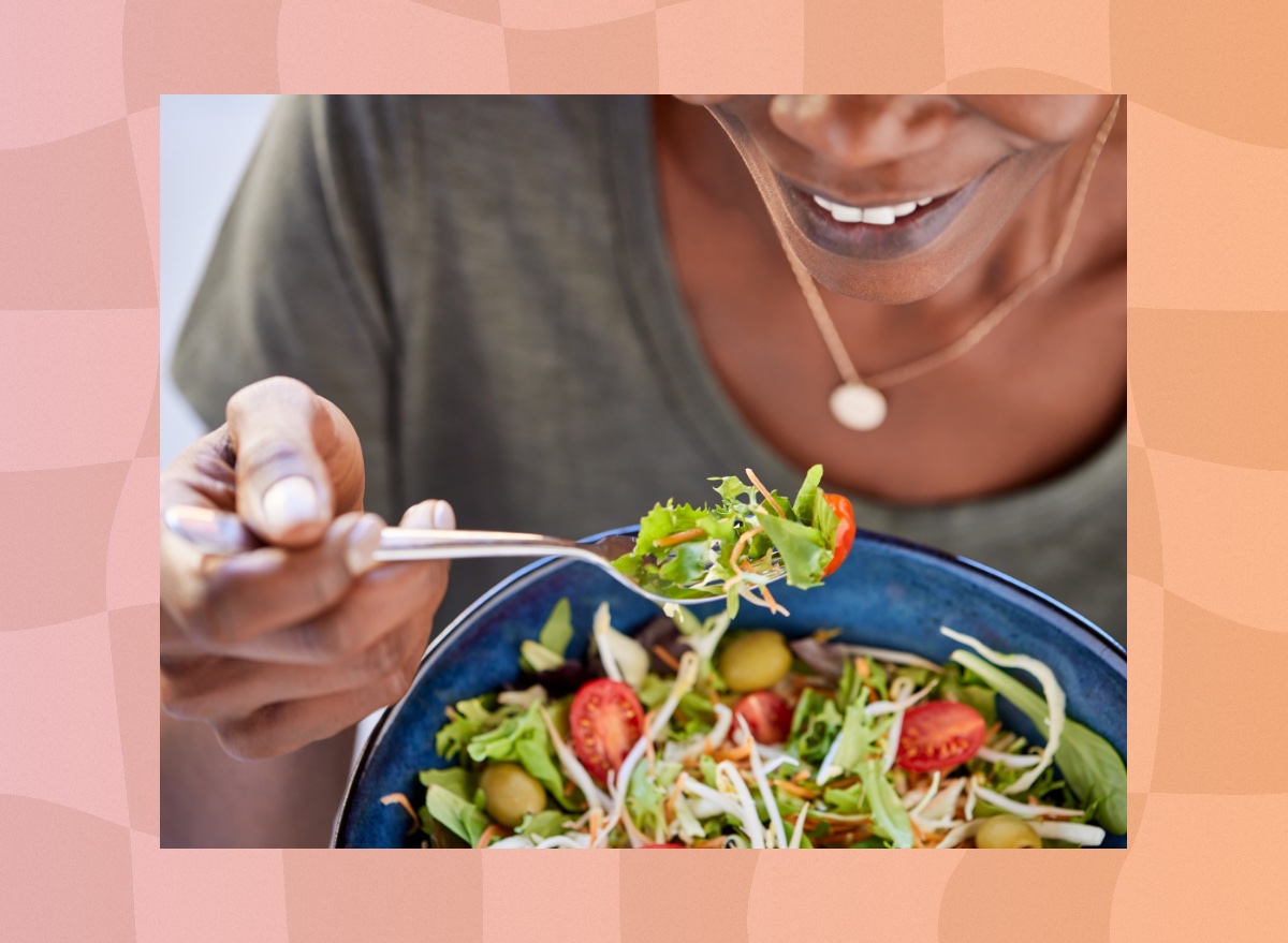 close-up of woman eating salad