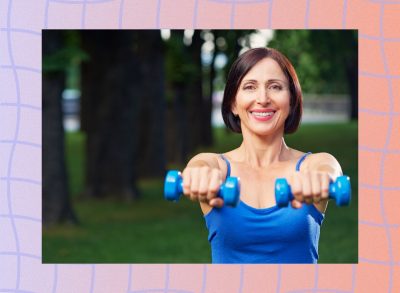 woman lifting lightweight dumbbells outdoors