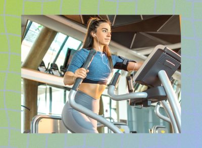 fit woman using an elliptical at the gym