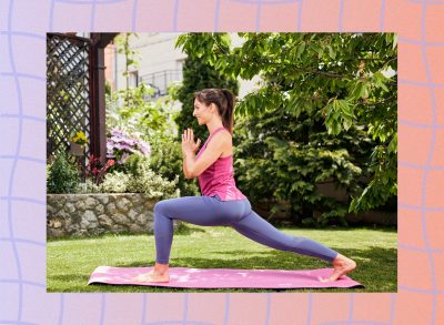 woman doing yoga lunges on yoga mat outdoors in back garden aread