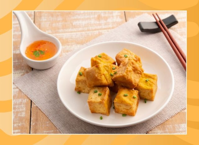 plate of air-fried tofu on an orange background