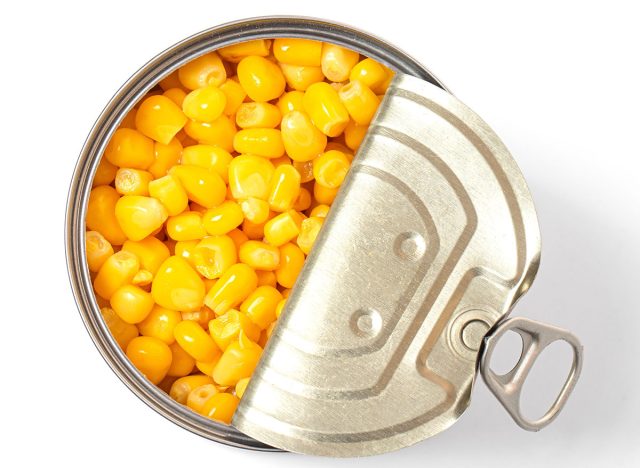 Sweet canned corn isolated on white background.