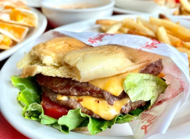 Friendly's burger and fries on table