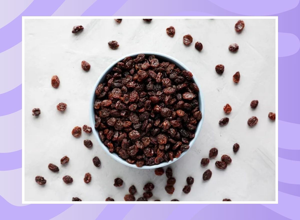 bowl of raisins on a purple background