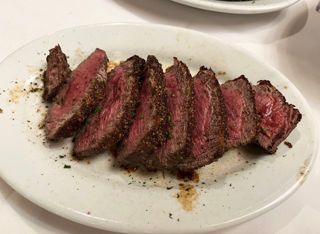 A sliced filet mignon on a white plate at Ruth's Chris Steak House