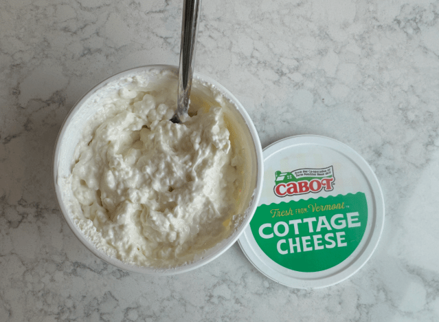 open container of cabot cottage cheese with spoon in it 