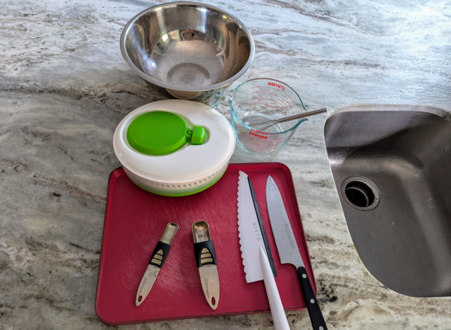 caesar salad tools on a countertop 