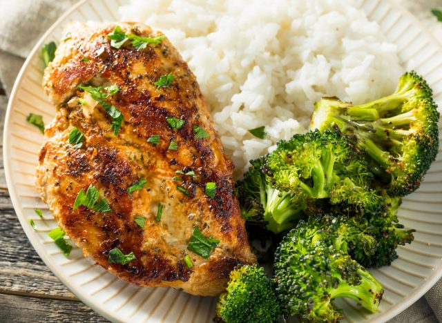 plate of seared chicken with broccoli and rice