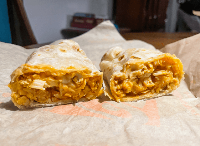 chicken enchilada burrito cut open on a wrapper