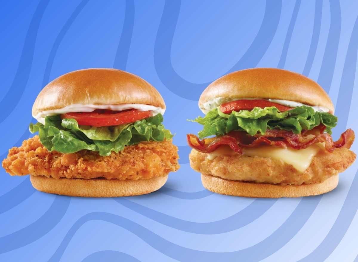 A pair of Wendy's chicken sandwich varieties, set against a vibrant blue background