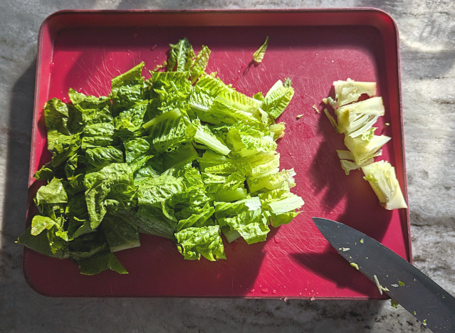 chopped lettuce on a cutting board 