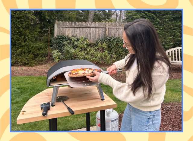 olivia cooking pizza in an ooni koda 16