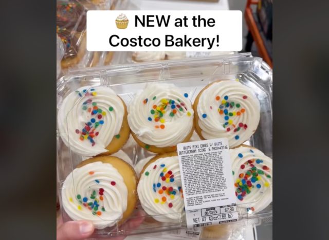 person holding costco bakery white mini cakes