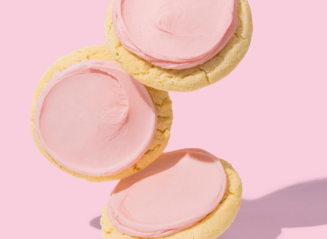 crumbl pink sugar cookies on pink background