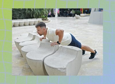 fit man doing incline pushups outdoors