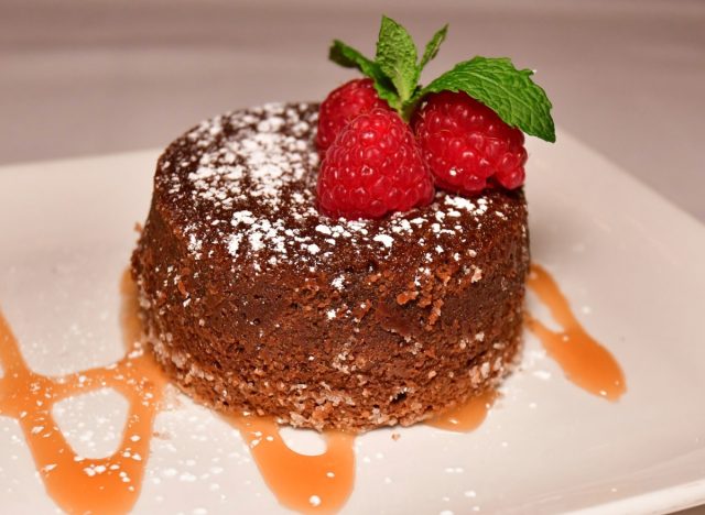 morton's legendary hot chocolate cake topped with raspberries and mint leaves