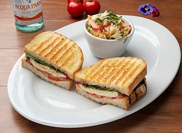 a caprese panini on a plate