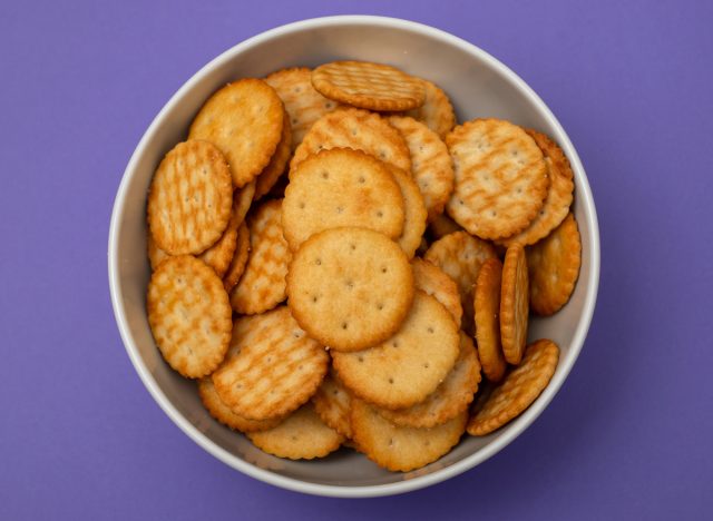 ritz crackers in bowl on purple background