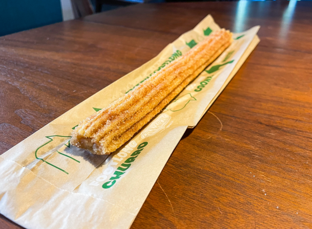 a cinnabon churro from subway on a table