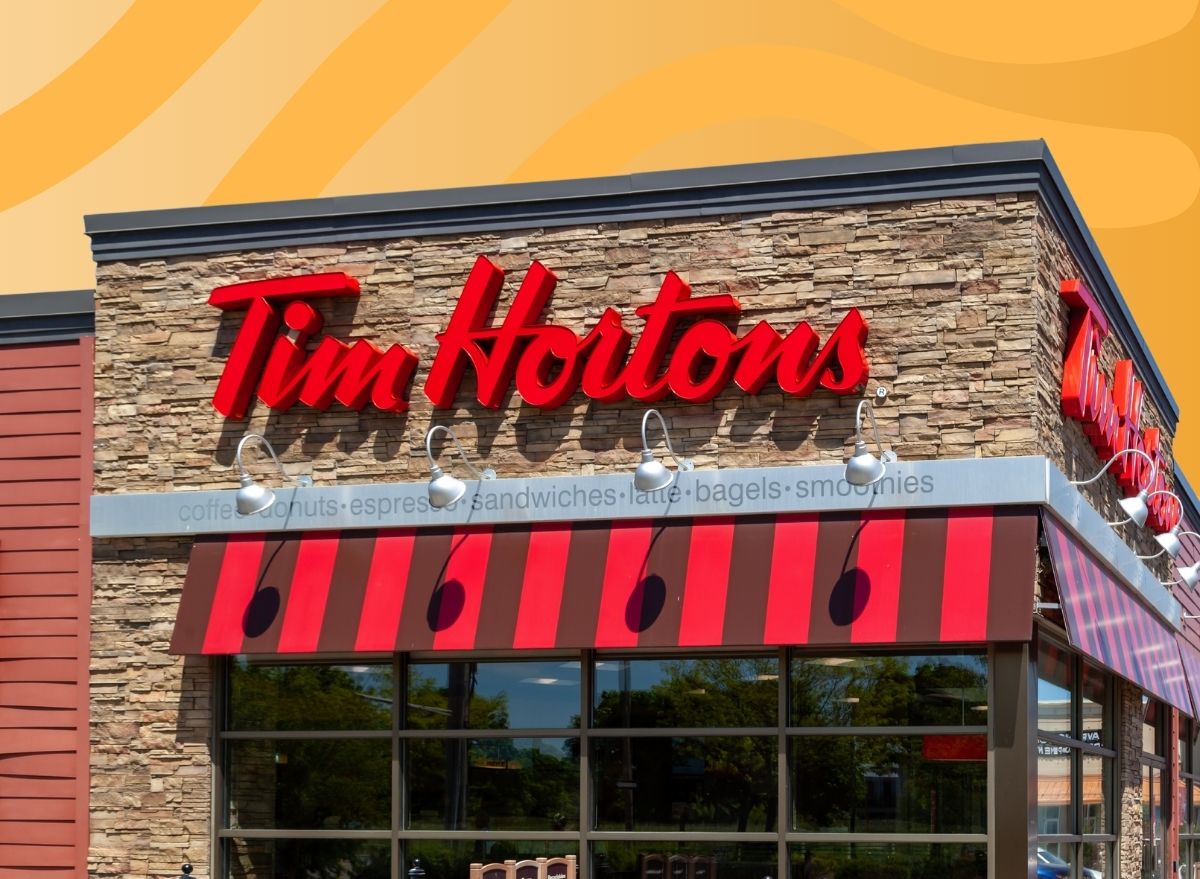 tim hortons restaurant exterior set against a designed orange background