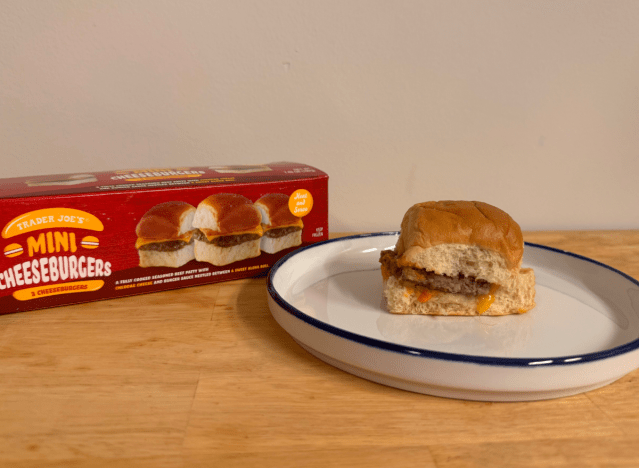 a box of trader joe's sliders with a slider ona. plate 