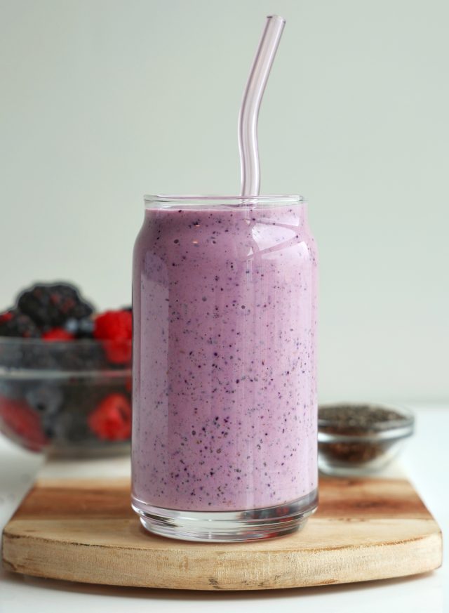 high protein triple berry smoothie in a glass close up