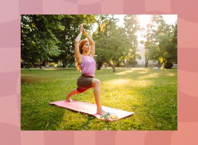 fit woman doing yoga exercises on mat outdoors in grassy, sunny park