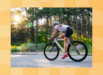 woman cycling outdoors on paved path