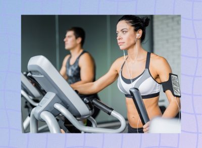 fit woman using elliptical at the gym