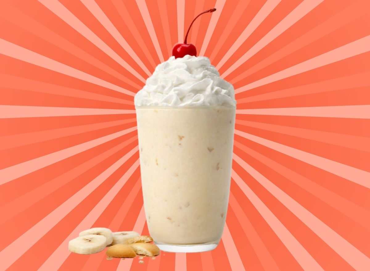 Chick-fil-A's new Banana Pudding Shake set against a vibrant orange background