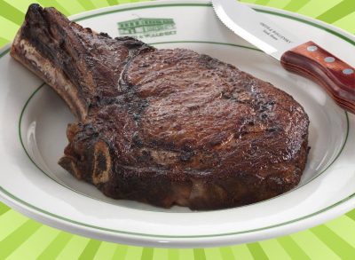 Dry-aged ribeye from Smith & Wollensky set against a vibrant green background