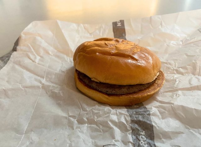 McDonald's hamburger on top of wrapper