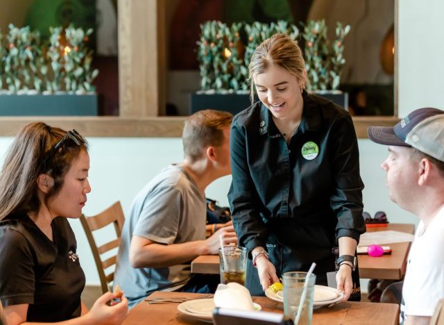 Olive Garden worker serving guests