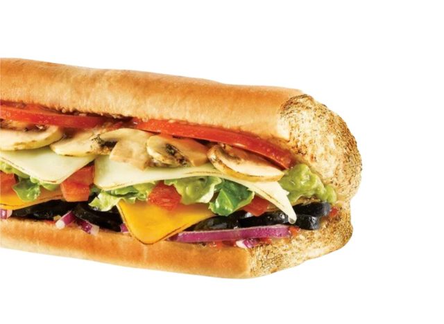 Quiznos Veggie Guacamole sub on a white background