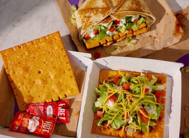 Taco Bell Big Cheez-It cracker, Crunchwrap, and Tostada on table