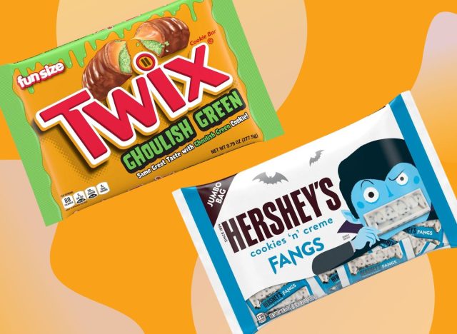 Halloween-themed Twix and Hershey's candies from Walmart set against a vibrant orange background