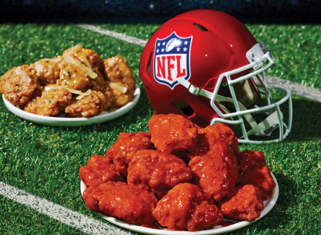 applebee's boneless wings and football helmet on a football field