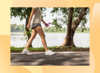 close-up of woman walking outdoors along lake trail