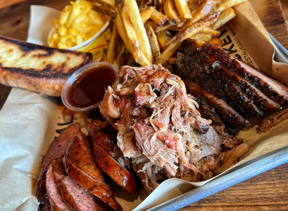 dickey's bbq pit 3 meat plate with fries, sauce, and mac and cheese